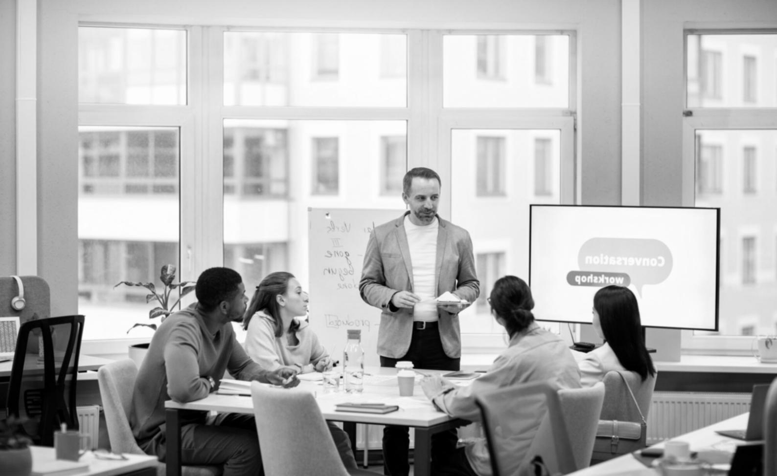 Professional training environment showing spreadsheet financial management in action